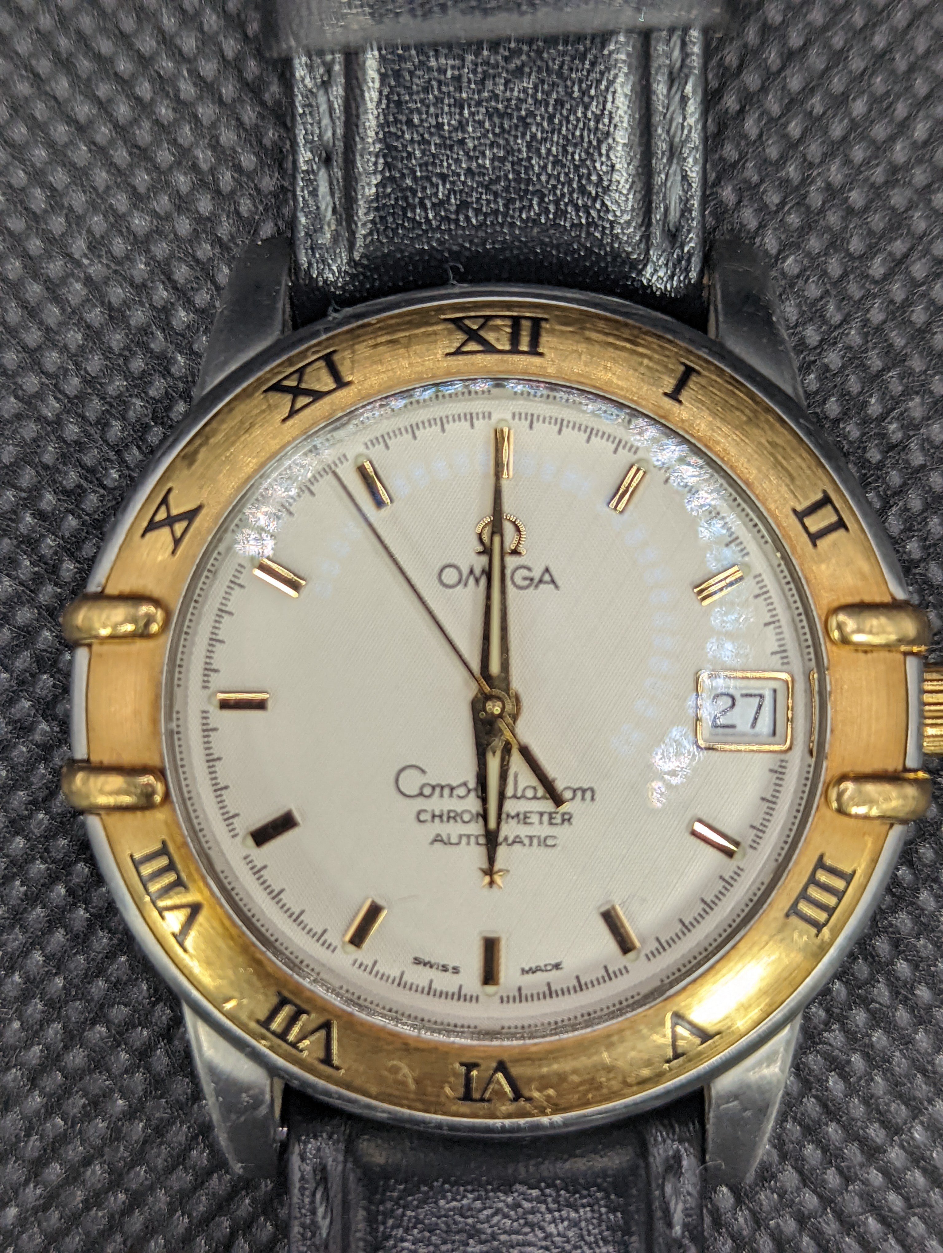 A gentleman's stainless steel and gold plated Omega Constellation Automatic wrist watch, on associated leather strap, case diameter 36mm